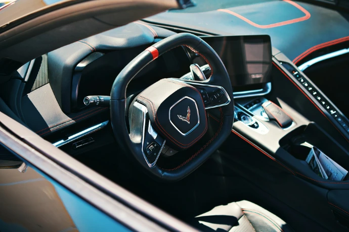 A modern car interior showcasing the steering wheel.